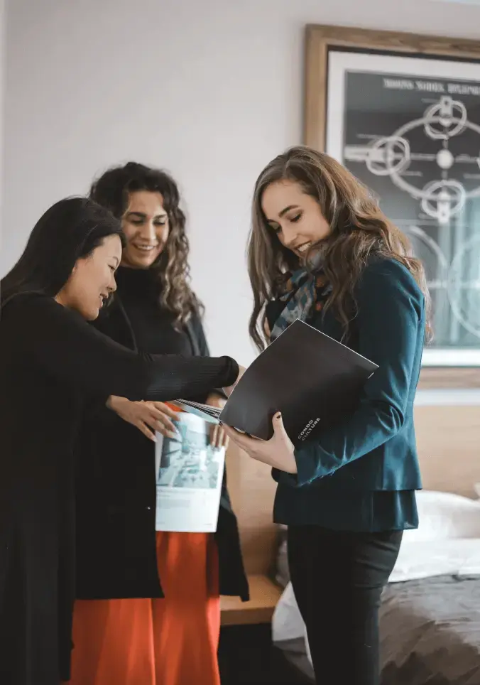 Condo Culture agent reviewing marketing plan with potential buyers